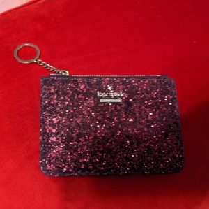 New with tags Kate Spade Laurel way glitter card holder. burgundy.